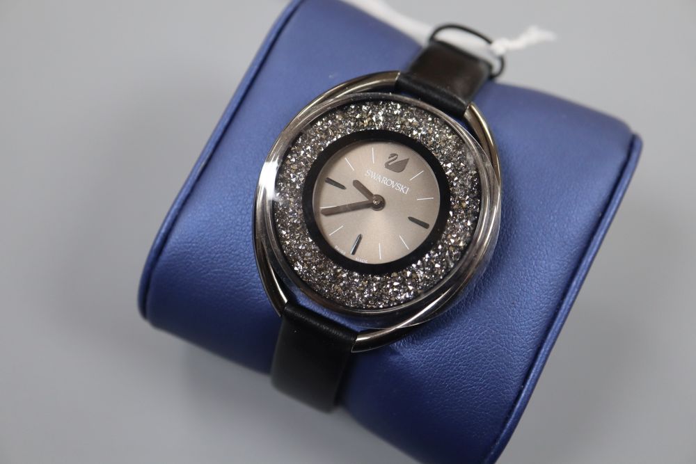 A modern stainless steel Swarovski wristwatch, with box.